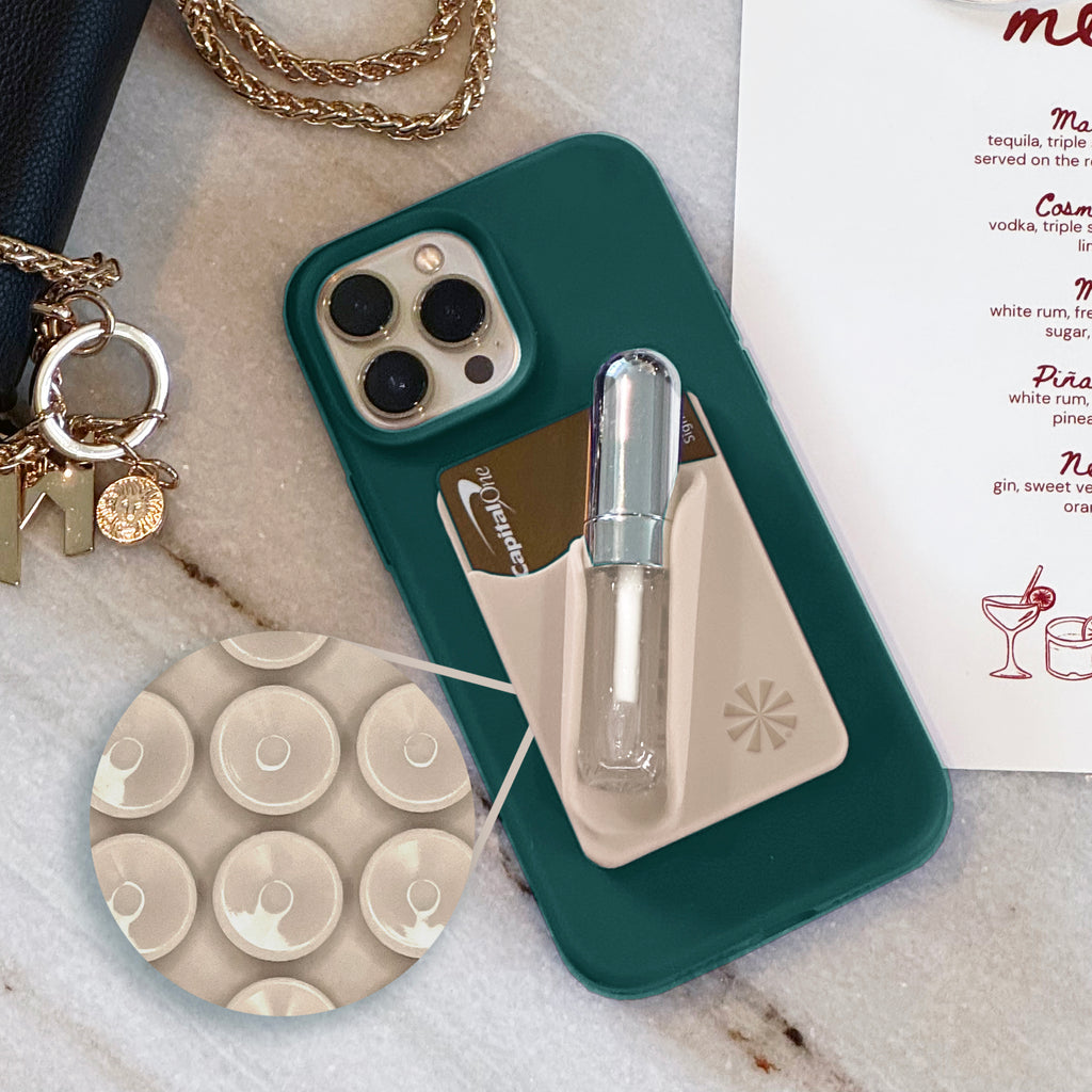 Tech Candy Bare Necessities uses suction cups that attach to your phone, not adhesive.