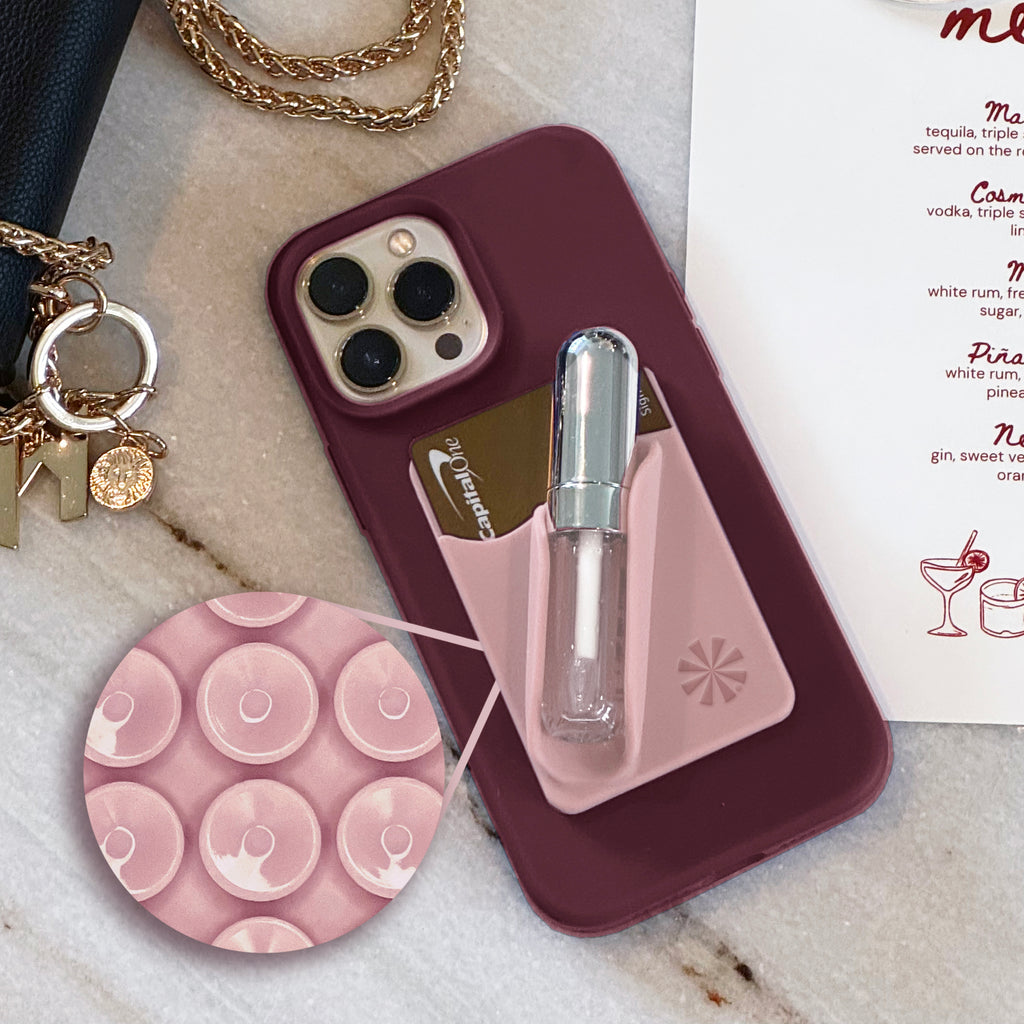 Tech Candy Bare Necessities uses suction cups that attach to your phone, not adhesive.