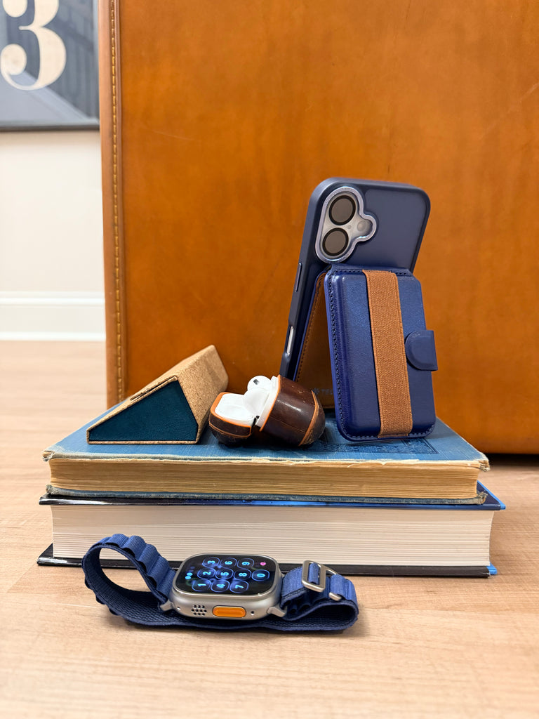 Tech Candy magnetic Back Pocket holds up to 4 cards, is a stand of your phone, and offers a back strap so you can hold your phone with ease. Shown in Navy/Camel color.
