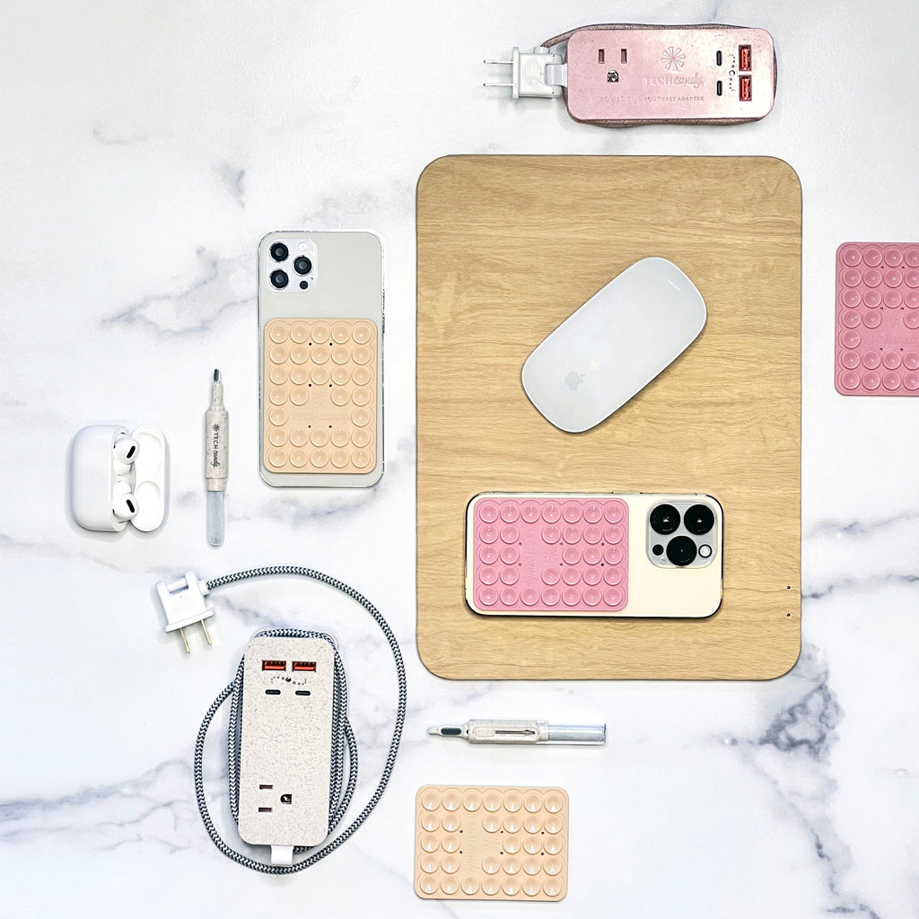 Power Trip Eco Outlet/USB/USB-C Fast-Charging Electronics Charging Station shown with Stick 'Em Up, Power Pad, and Teenie Weenie Earbud Cleanie products