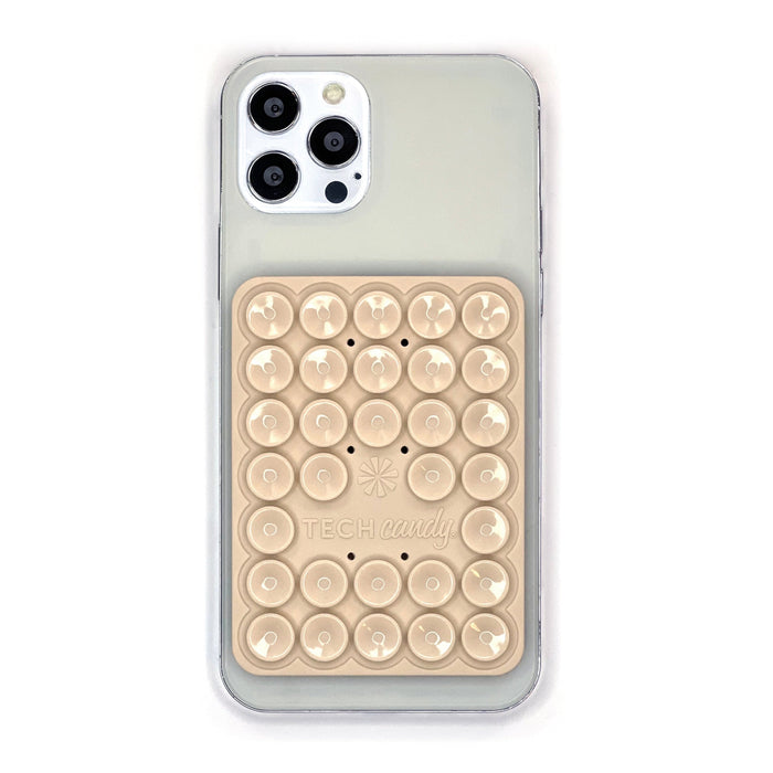 Stick 'Em Up 2-Sided Phone Suction Pad : Natural shown on an iPhone