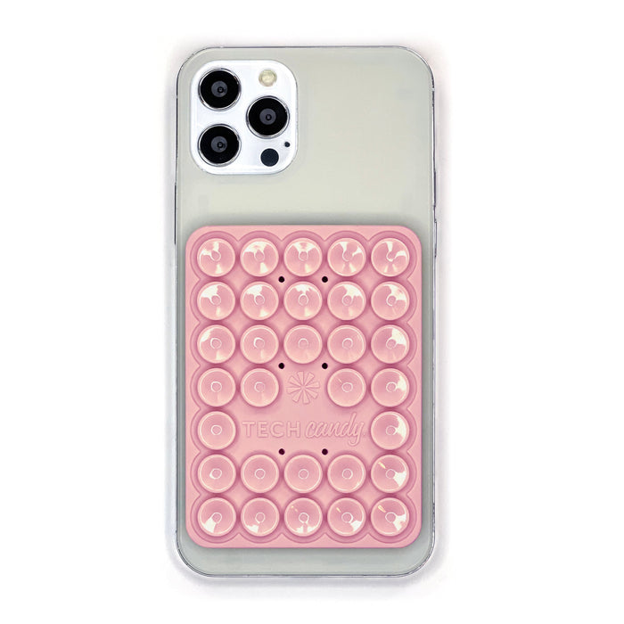 Stick 'Em Up 2-Sided Phone Suction Pad : Pink shown on an iPhone