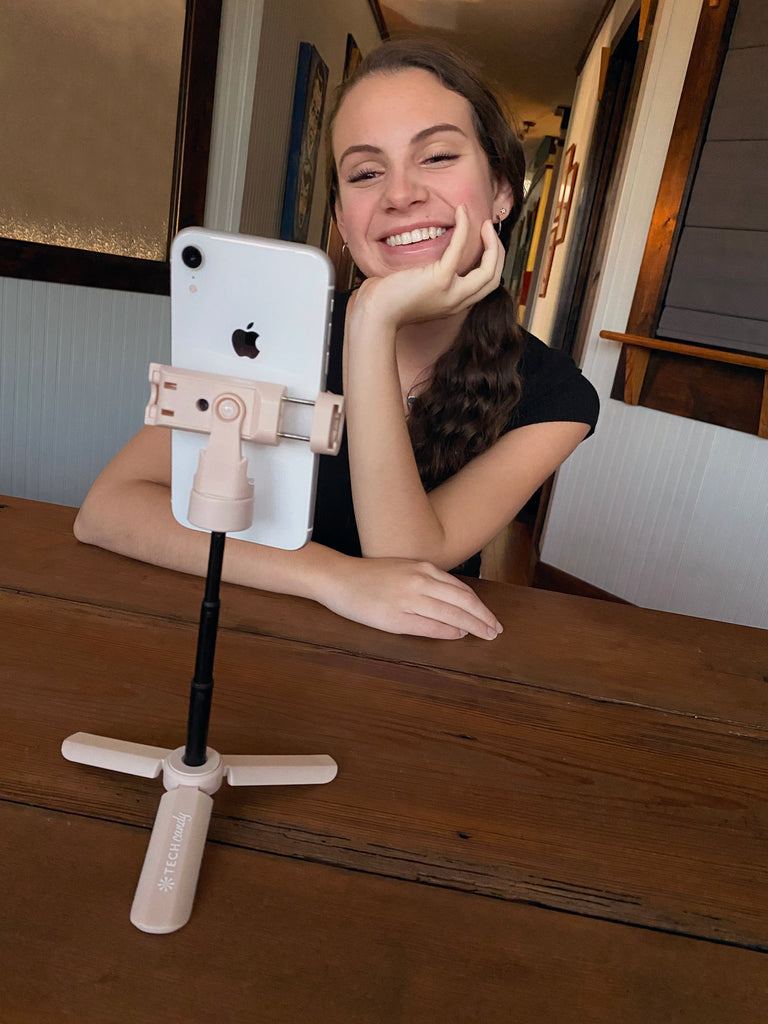 Stand and Deliver holding an iPhone XR