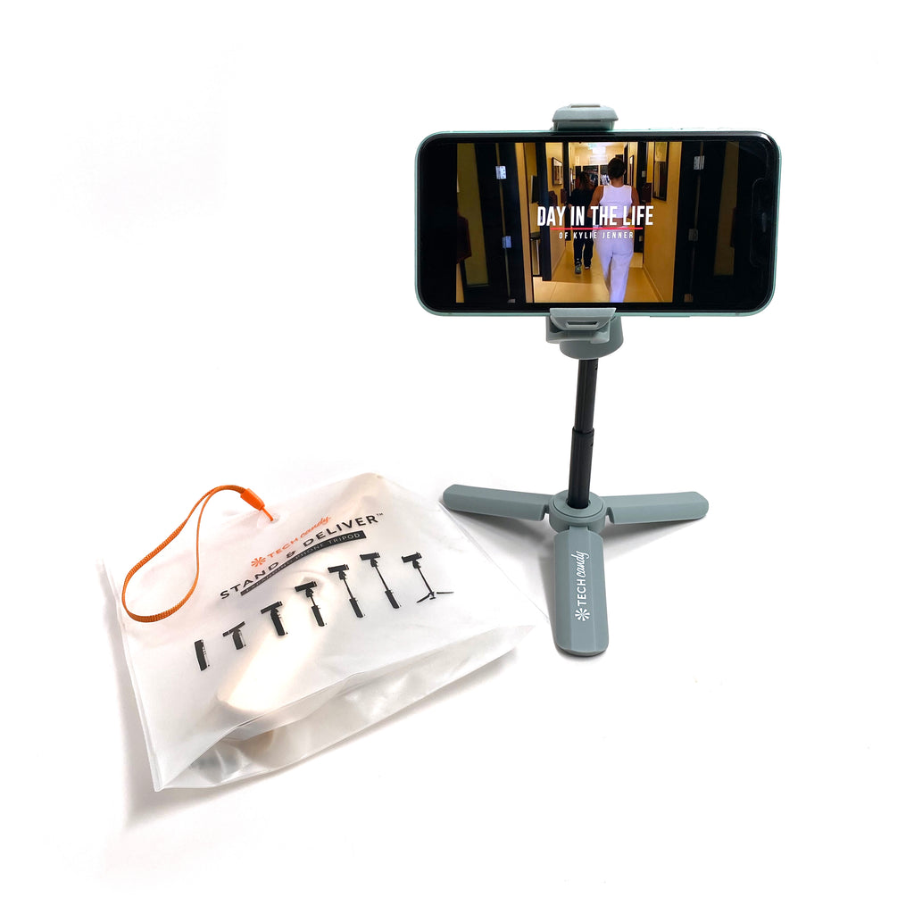 Stand and Deliver holding an iPhone 11 with packaging